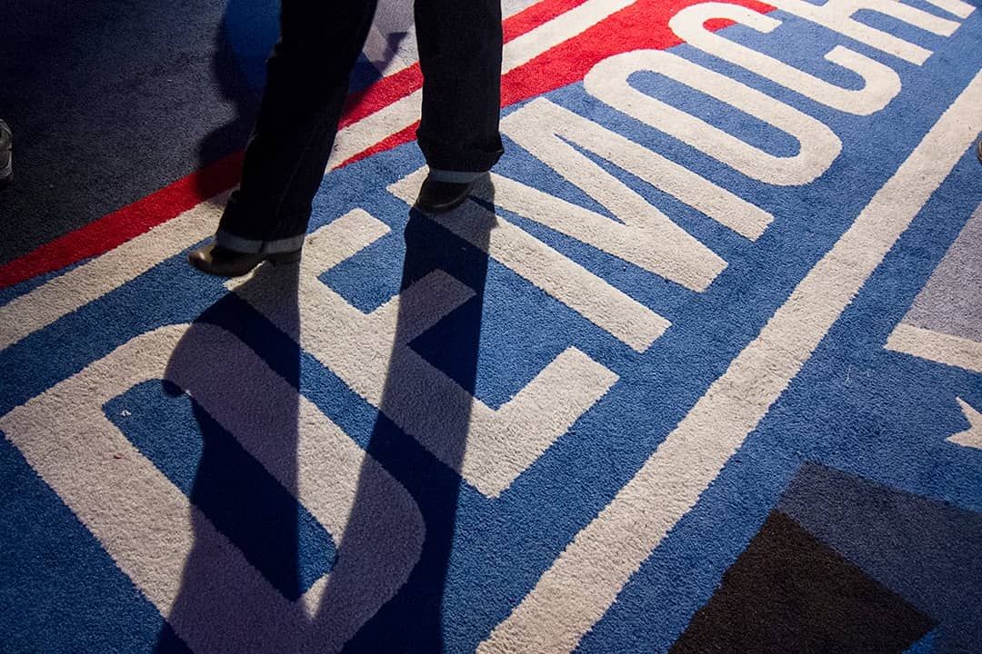 Man stepping on ground painted for the Democracy Plaza in New York City.